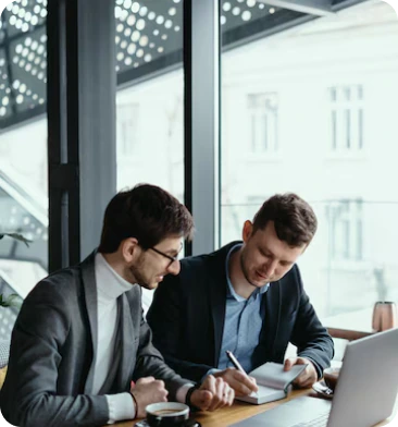 Consultants reviewing a business and technology plan